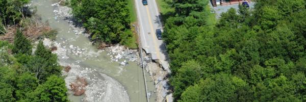 Mansfield Heliflight, Tropical Storm Irene 2011 Winding river cutting into road with houses and trees